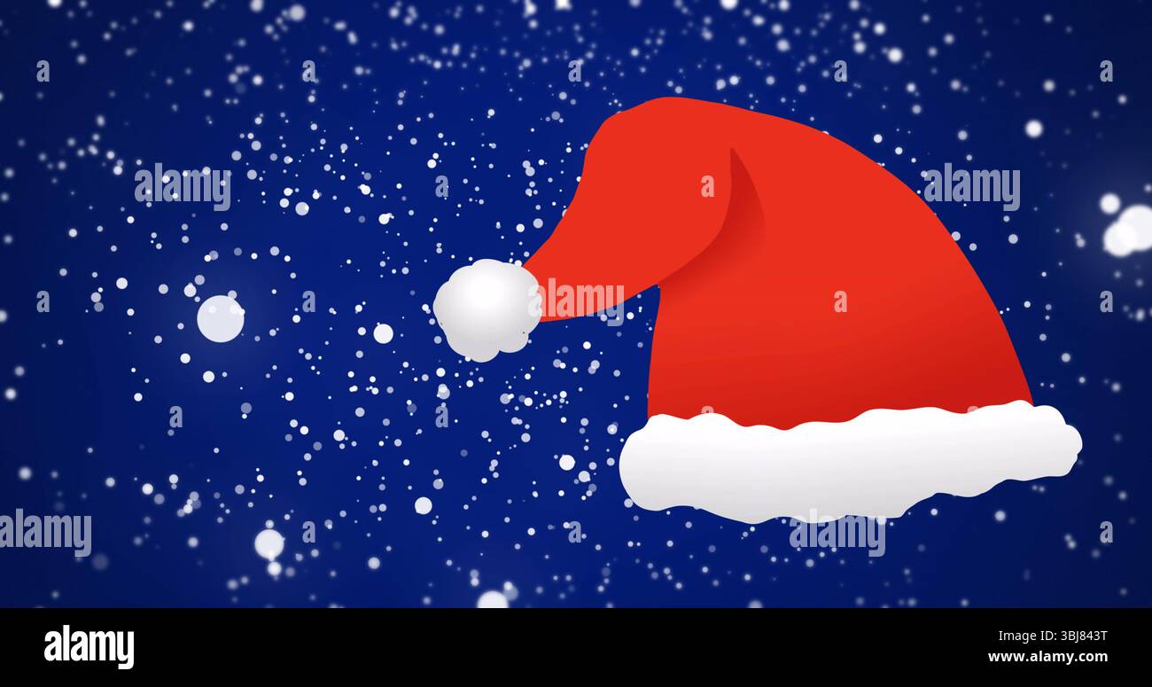 Drifting red Santa hat with white trim and pom-pom across winter sky, with falling snowflakes Stock Photo