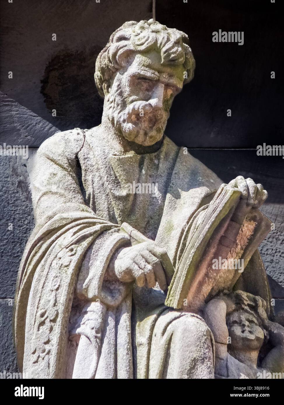 An ancient statue of St. Matthew writing his Gospel at Rosslyn Castle ...