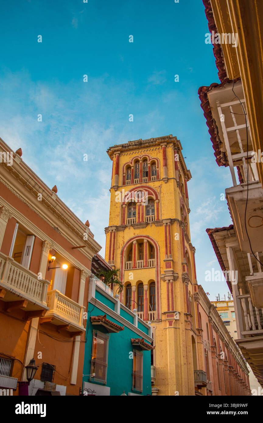 Colonial Clocktower Building A vibrant view of a historic clock tower framed by colorful colonial ...