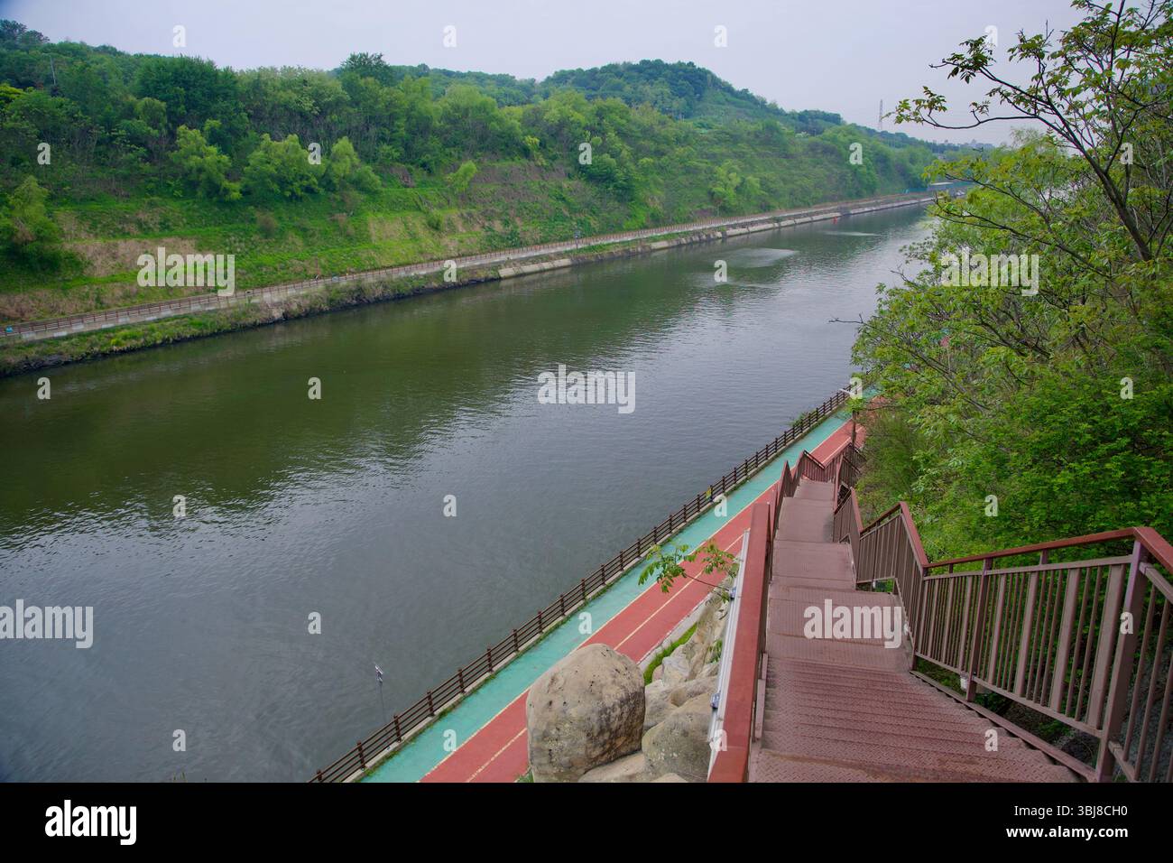 Incheon, South Korea - May 19th 2025: Looking down a metal staircase ...