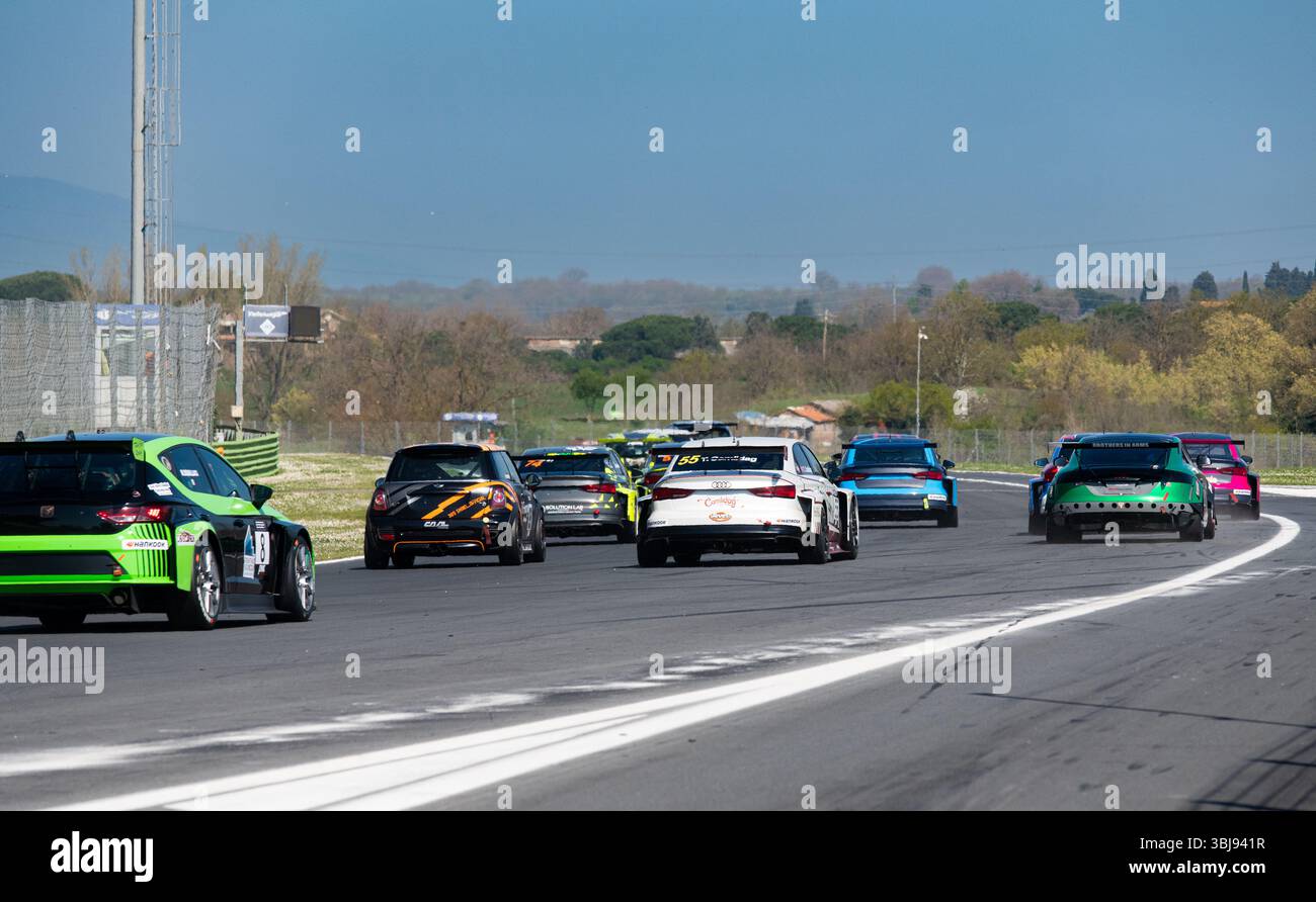 Action speed group of racing TCR cars after race start on track rear ...