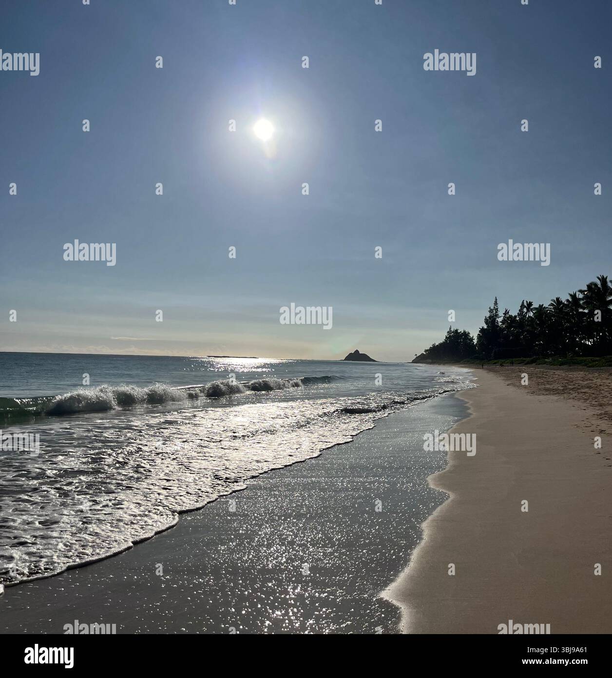 Waves washing ashire the sandy, picturesque and peaceful scenery of the beautiful Kailua Beach on the island of O'ahu, Hawai'i, USA. - Smartphone Captured Stock Image