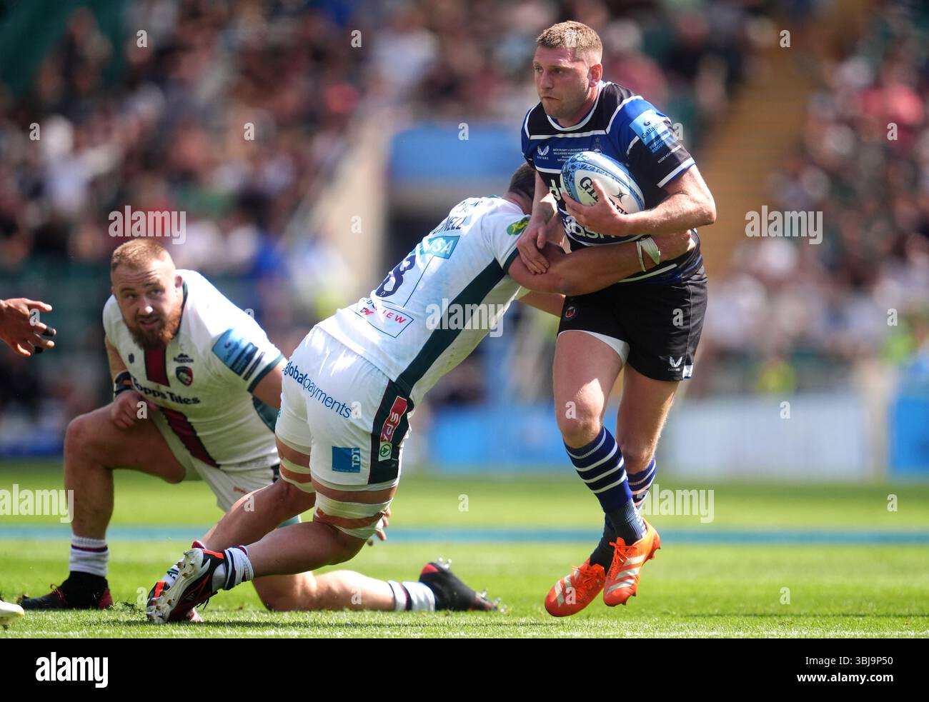 Fin Rusell Rugby Bath Rugby's Finn Russell (right) is tackled by Leicester Tigers' Olly ...