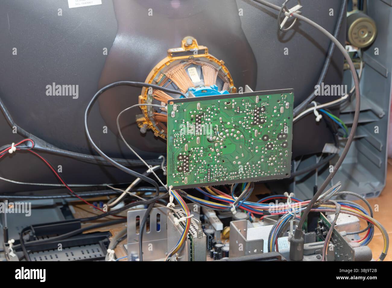 Close up of internal components of crt tv, revealing complex circuitry
