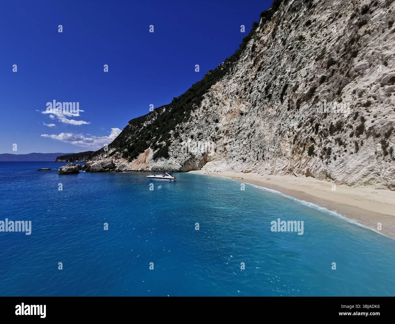 Afales Bay on the north coast of Ithaca Island in the Ionian Sea, Greece. Stunning white beaches backed by dramatic limestone cliffs. - Smartphone Captured Stock Image