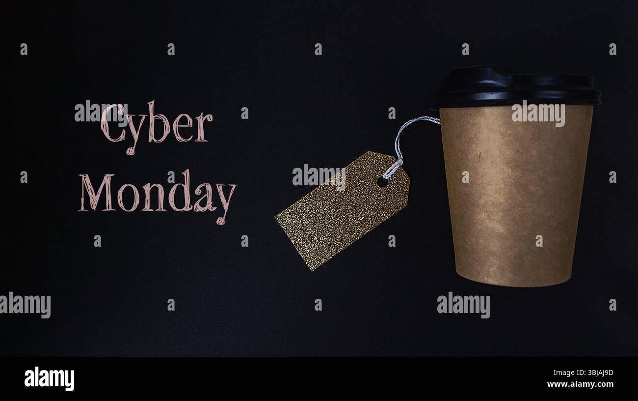 Coffee cup with a golden tag hanging from it with the words Cyber Monday Stock Photo