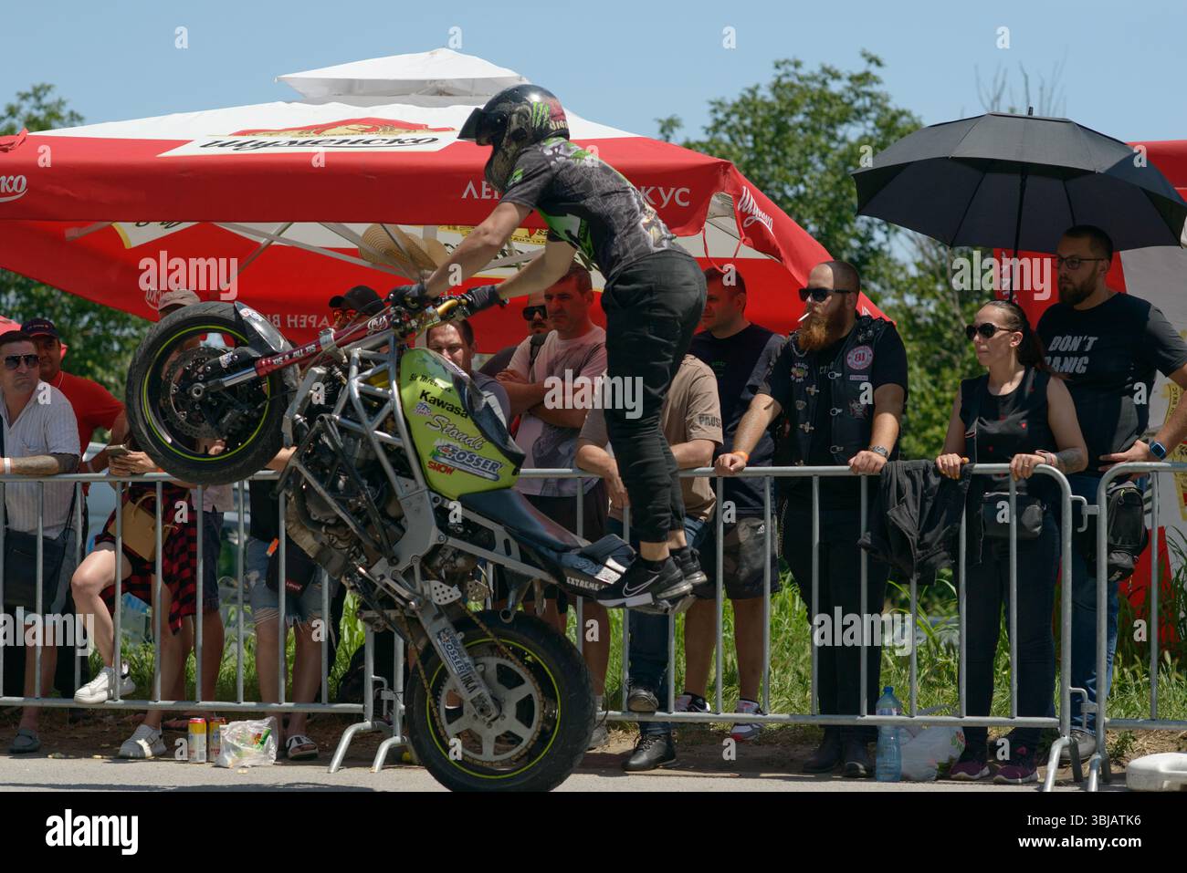 Varna Riders A member of the Extreme Attack stunt team executes a stand-up wheelie ...