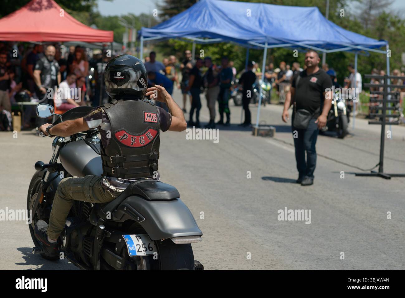 Varna Riders A biker wearing a leather club vest marked “Ruse” sits on a cruiser ...