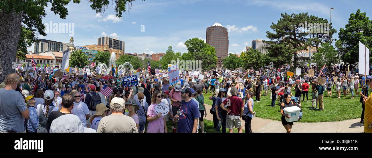 Protest Or Rally A large crowd gathers in a park for a protest or rally, holding signs ...