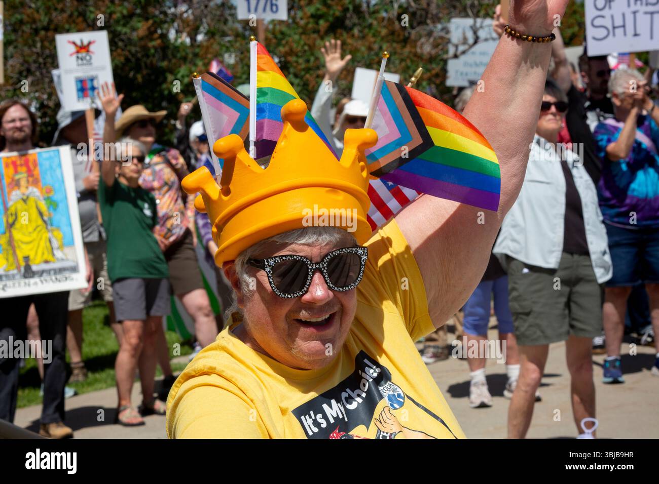 Helena, Montana, USA. 14th June, 2025. Demonstrators cheer during the “No Kings” rally at the Montana State Capitol. The national day of action and mass mobilization was organized by the 50501 movement and local organizations in response to perceived authoritarian actions of the Trump administration. Credit: Paul Christian Gordon/Alamy Live News Stock Photo