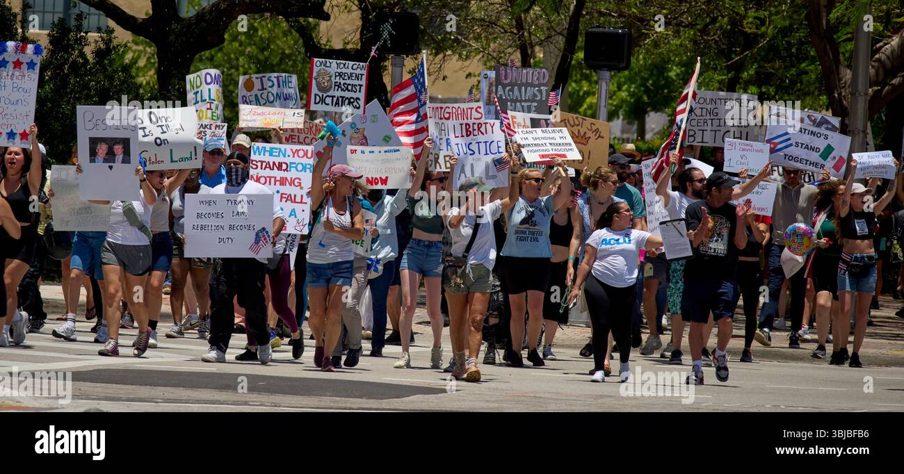 Miami, Florida, USA. 14th June, 2025. A mass of protesters chant and ...