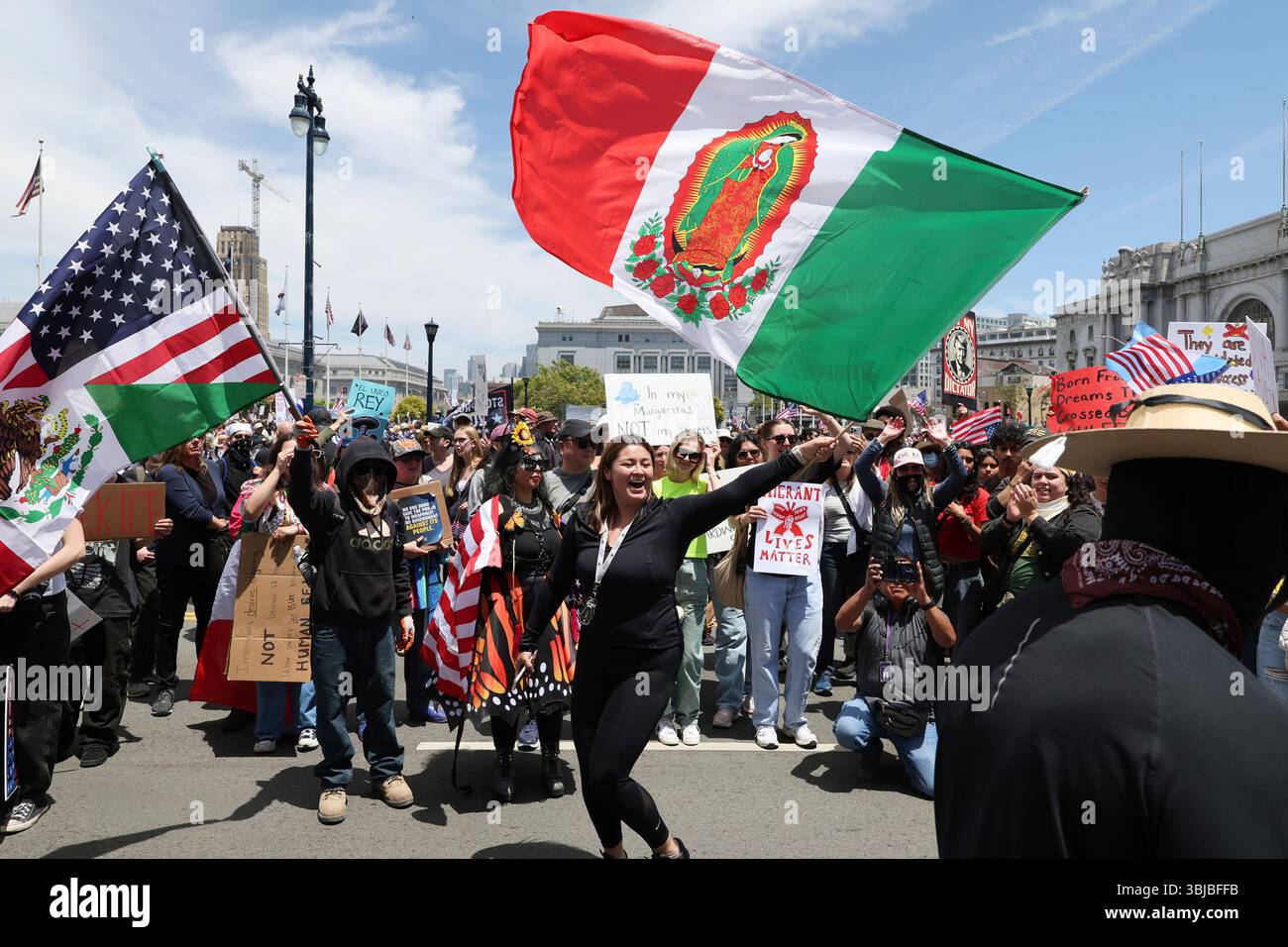 Demonstrators wave flags during a protest on Saturday, June 14, 2025 ...