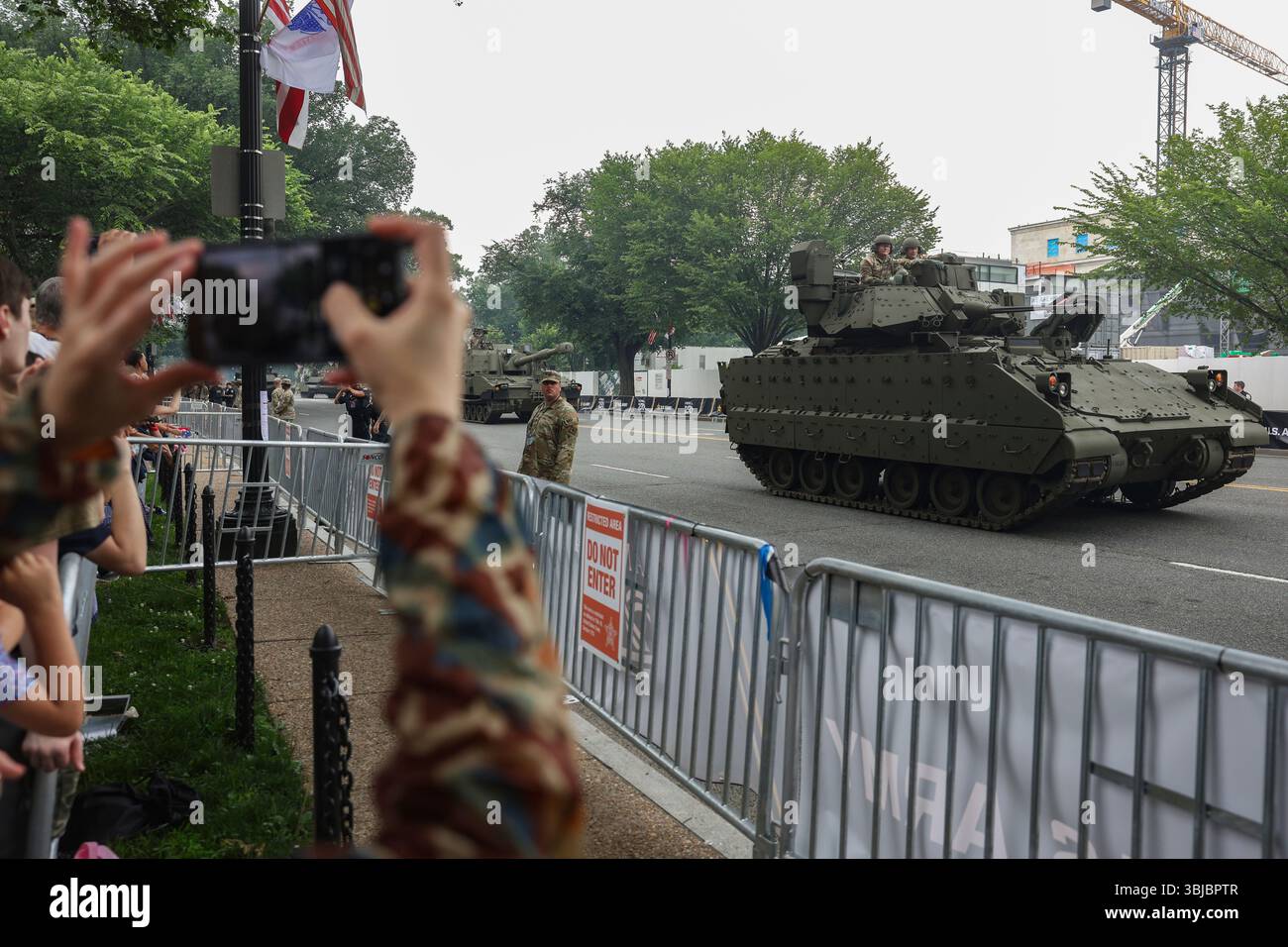 Tanks roll along Constitution Avenue during a military parade ...