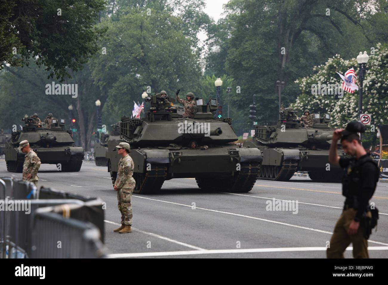 Tanks roll along Constitution Avenue during a military parade ...