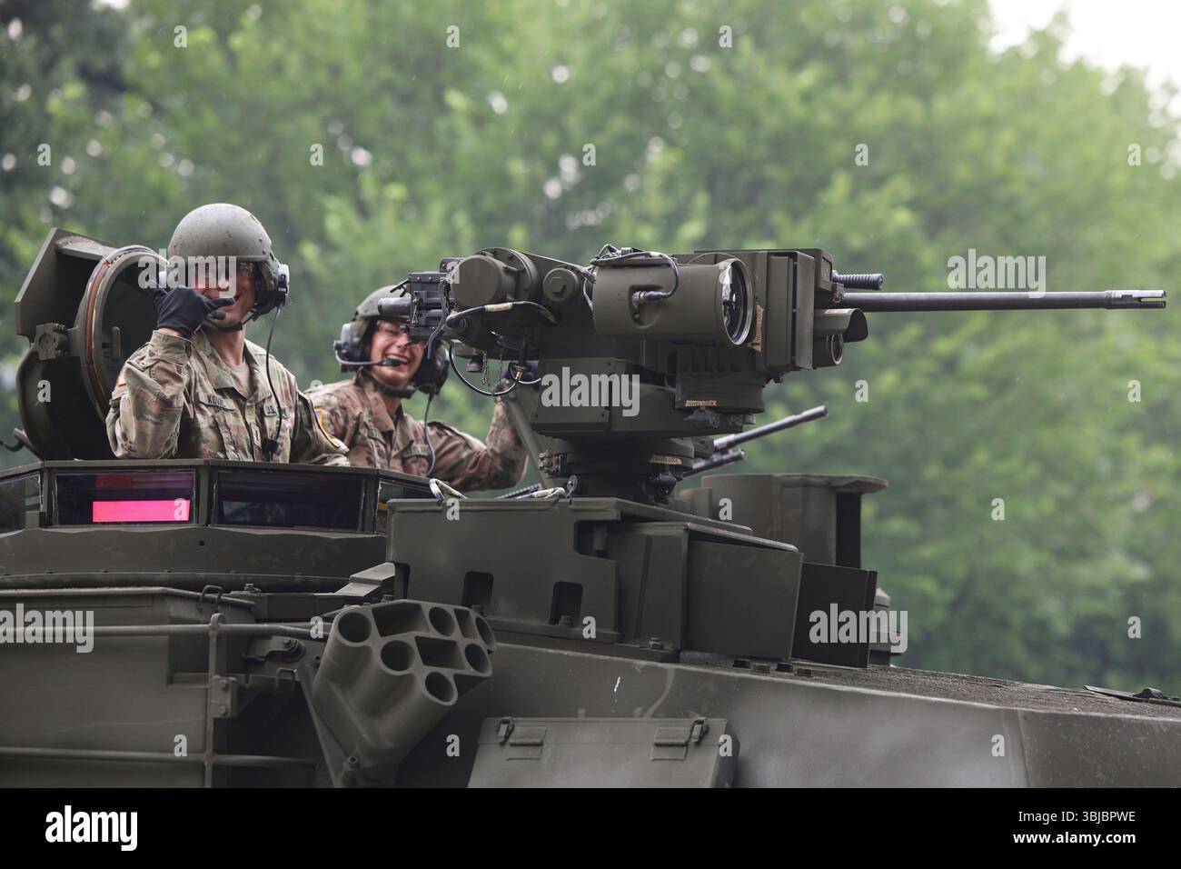 Tanks roll along Constitution Avenue during a military parade ...