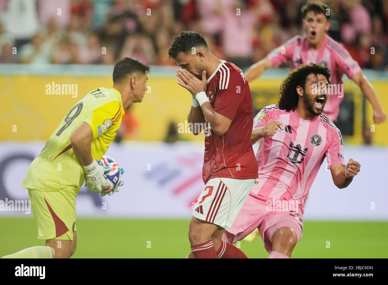 Al Ahly's Trezeguet, center, reacts after missing a chance to score ...
