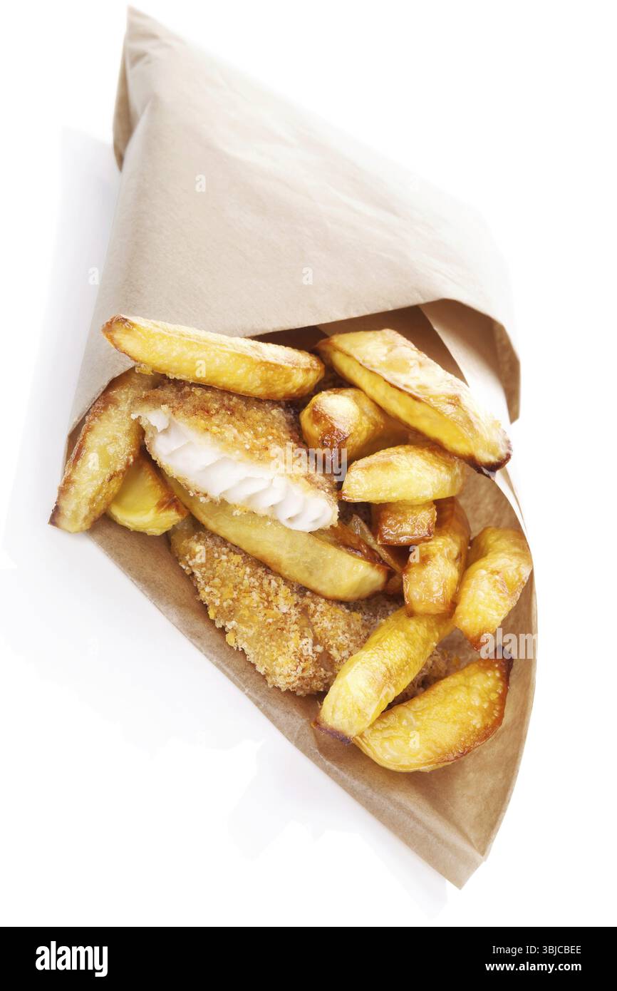 Delicious golden fish and chips in brow bag. Traditional english eating. Unhealthy fast and junk food Stock Photo