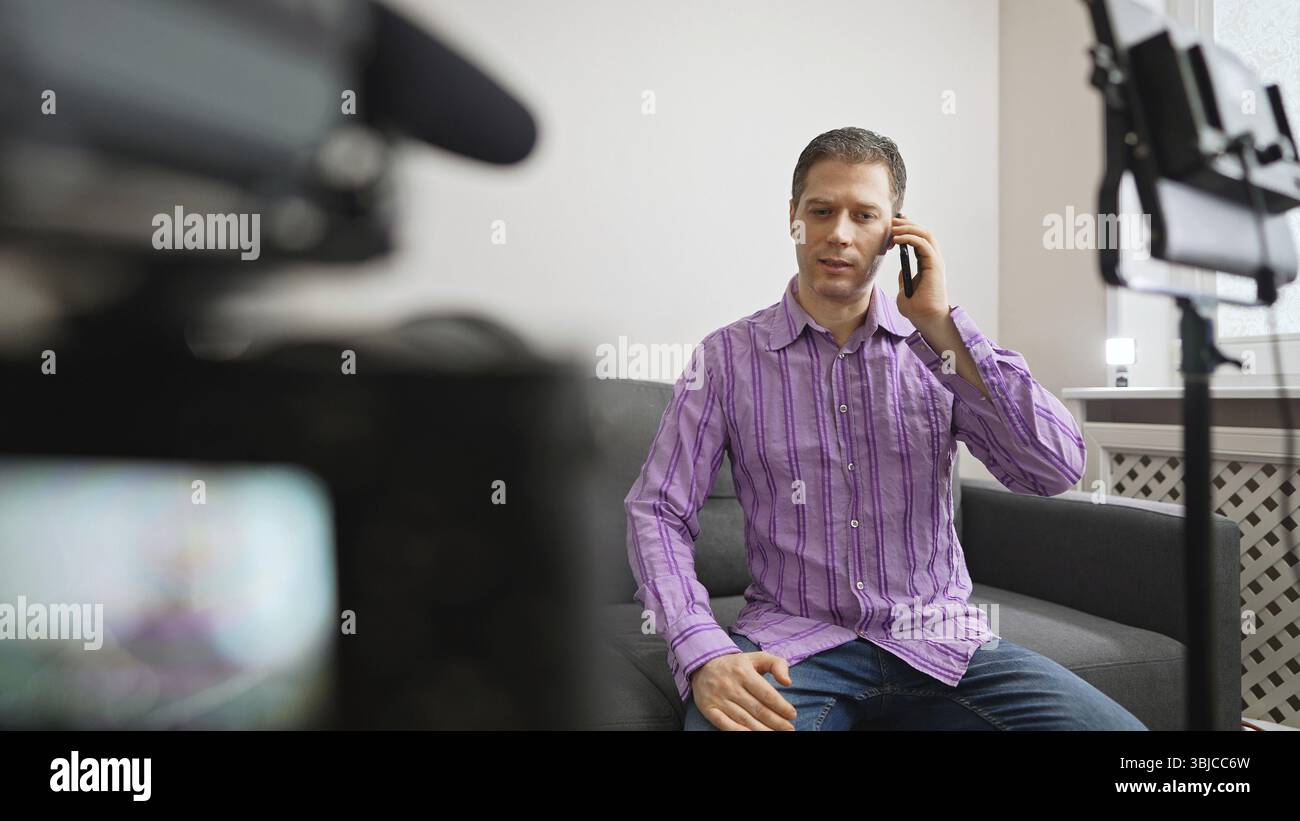 Man calling by phone from video studio Stock Photo