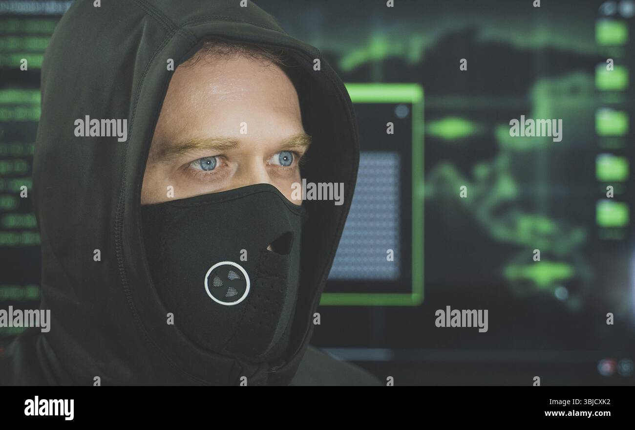 Hacker in black mask. Hacking and internet security concept Stock Photo