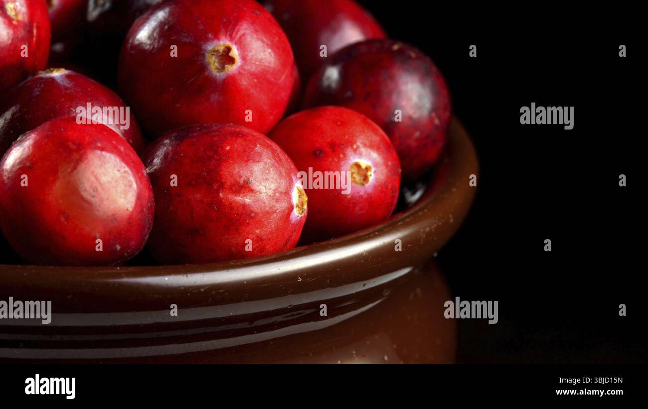 Lot of fresh ripe cranberries in pot Stock Photo