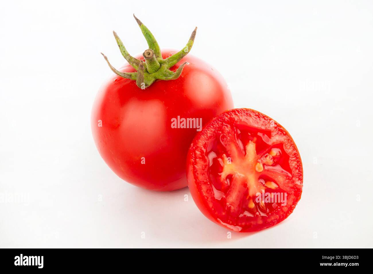 Fresh red tomatoes isolated on white background. Stock Photo