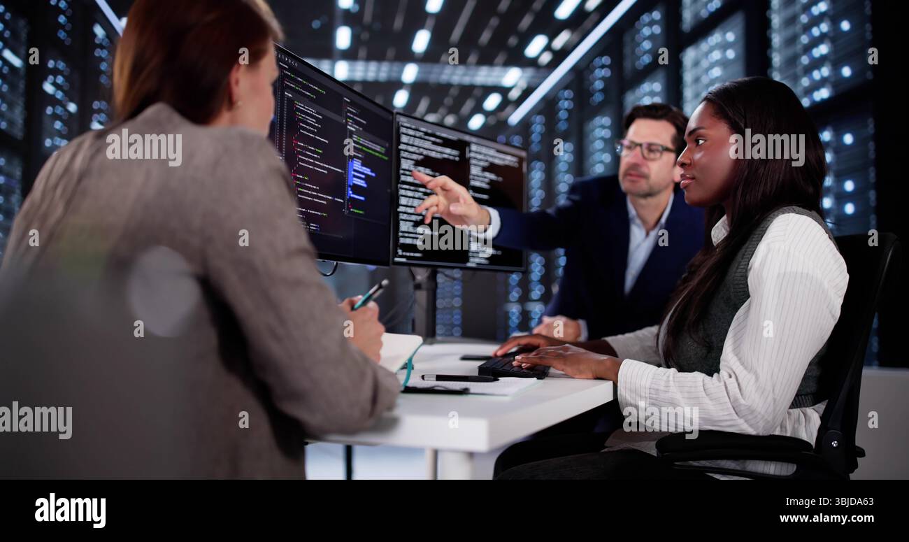 Innovative African Programmer Collaborating With Diverse Development Team In Cyber Office Stock Photo