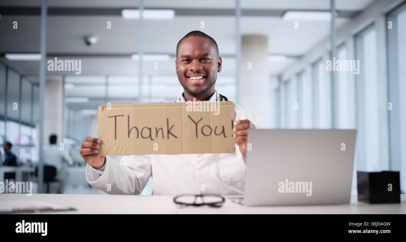 Thumbs up young african doctor hi-res stock photography and images - Alamy