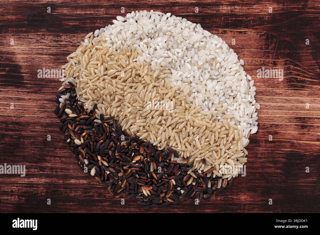 Random Rice Shape Different kinds of raw rice in circle shape on dark wooden background ...