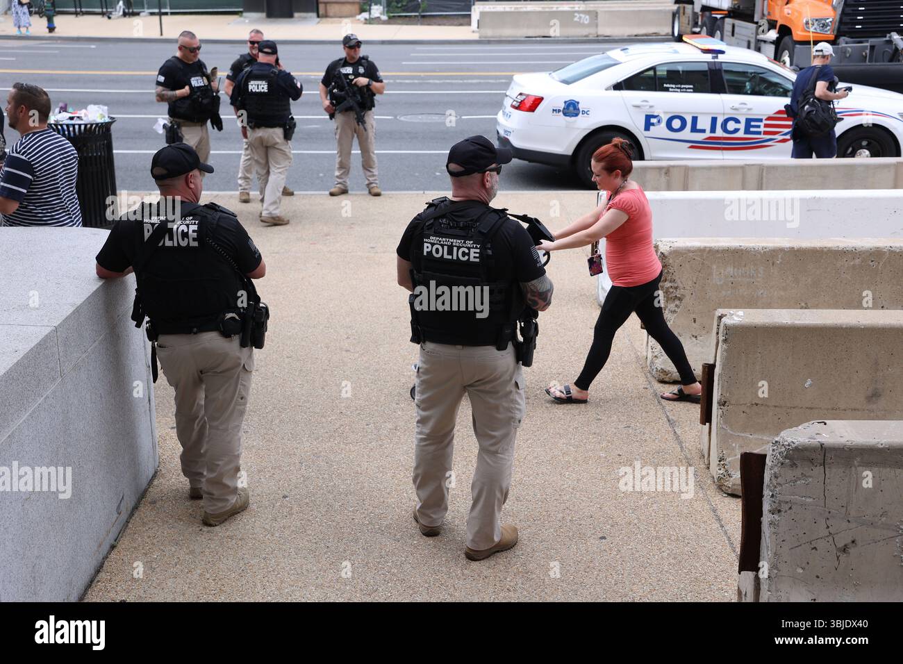 Washington Dc, Virginia, USA. 14th June, 2025. Homeland Security Police officers monitor the entrance of the Smithsonian Metro Station during the Army 250th Anniversary Parade in Washington, DC, USA, on June 14, 2025. The parade, which happened to coincide with US President Donald TrumpÃs 79th birthday, is expected to cost up to 5 million and feature nearly 7,000 troops plus dozens of tanks and helicopters. (Credit Image: © Gent Shkullaku/ZUMA Press Wire) EDITORIAL USAGE ONLY! Not for Commercial USAGE! Stock Photo