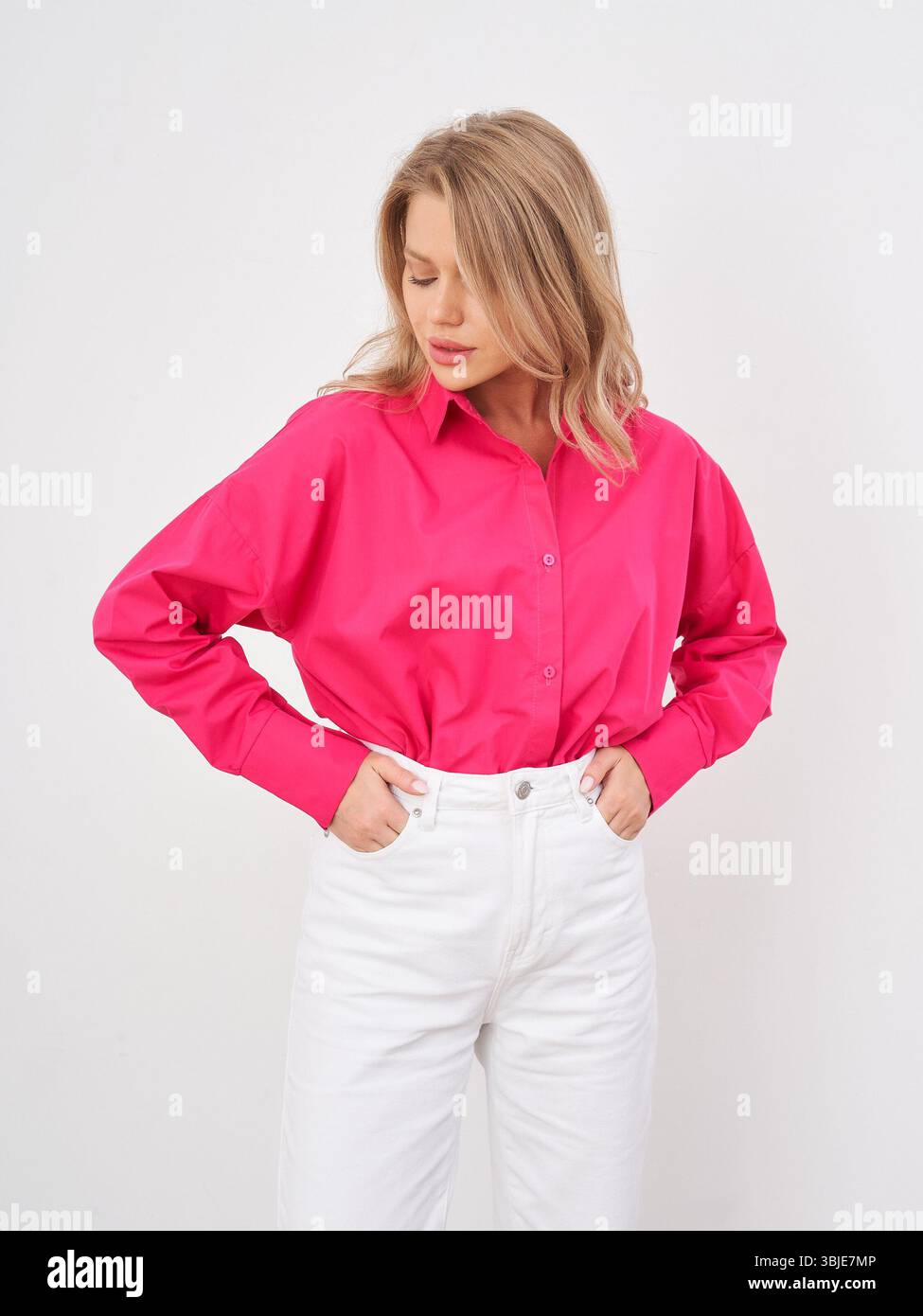 Woman wearing pink top jeans hi-res stock photography and images - Alamy