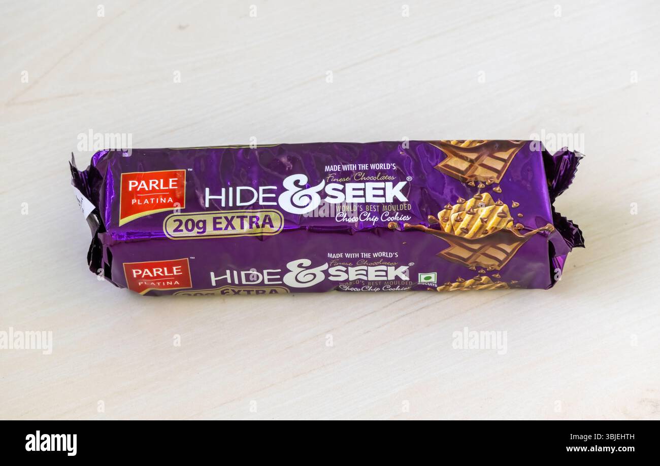 Unopened Parle Platina Hide and Seek Choco Chip Cookies packet on wooden surface. Premium Indian chocolate biscuits. Stock Photo