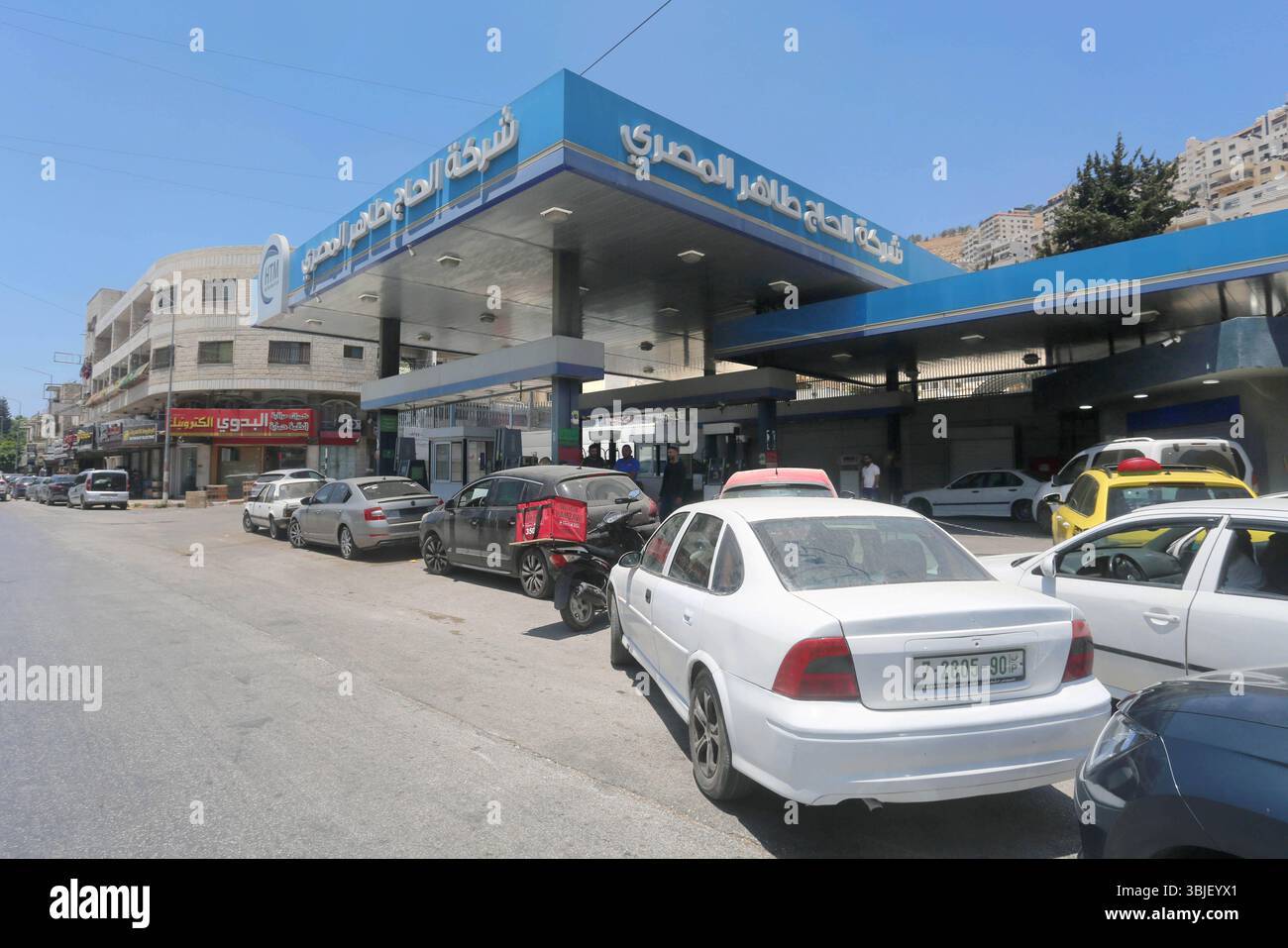 Nablus Line Nablus, Palestine. 15th June, 2025. Palestinian cars line up outside ...