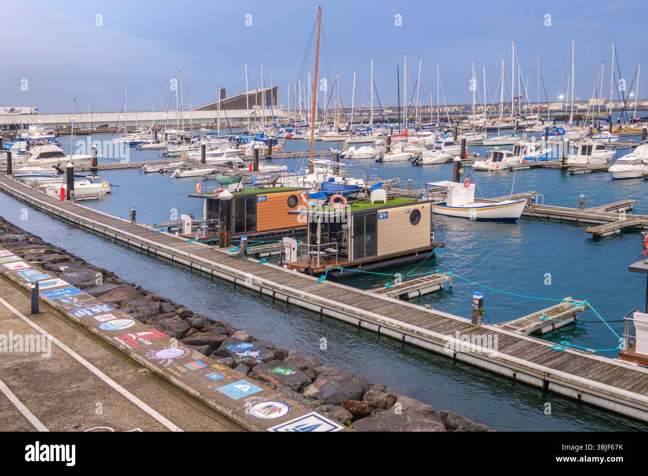 Modern Floating Houses in Ponta Delgada Marina Amidst Numerous Yachts. Unique Waterfront Living, Azorean Harbor, Leisure Boats, Contemporary Design Stock Photo