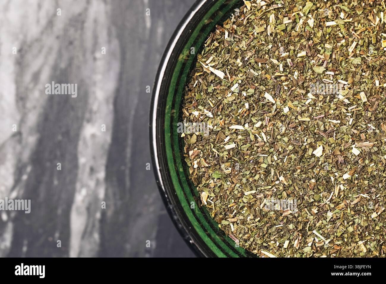 Ground peppermint tea. Herbal green powder. Organic mint herb. Natural dried leaf mix. Vegan aroma ingredient. Flatlay macro closeup. Stock Photo