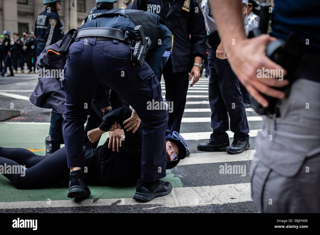 New York Police officers arrest a protestor during a demonstration in ...