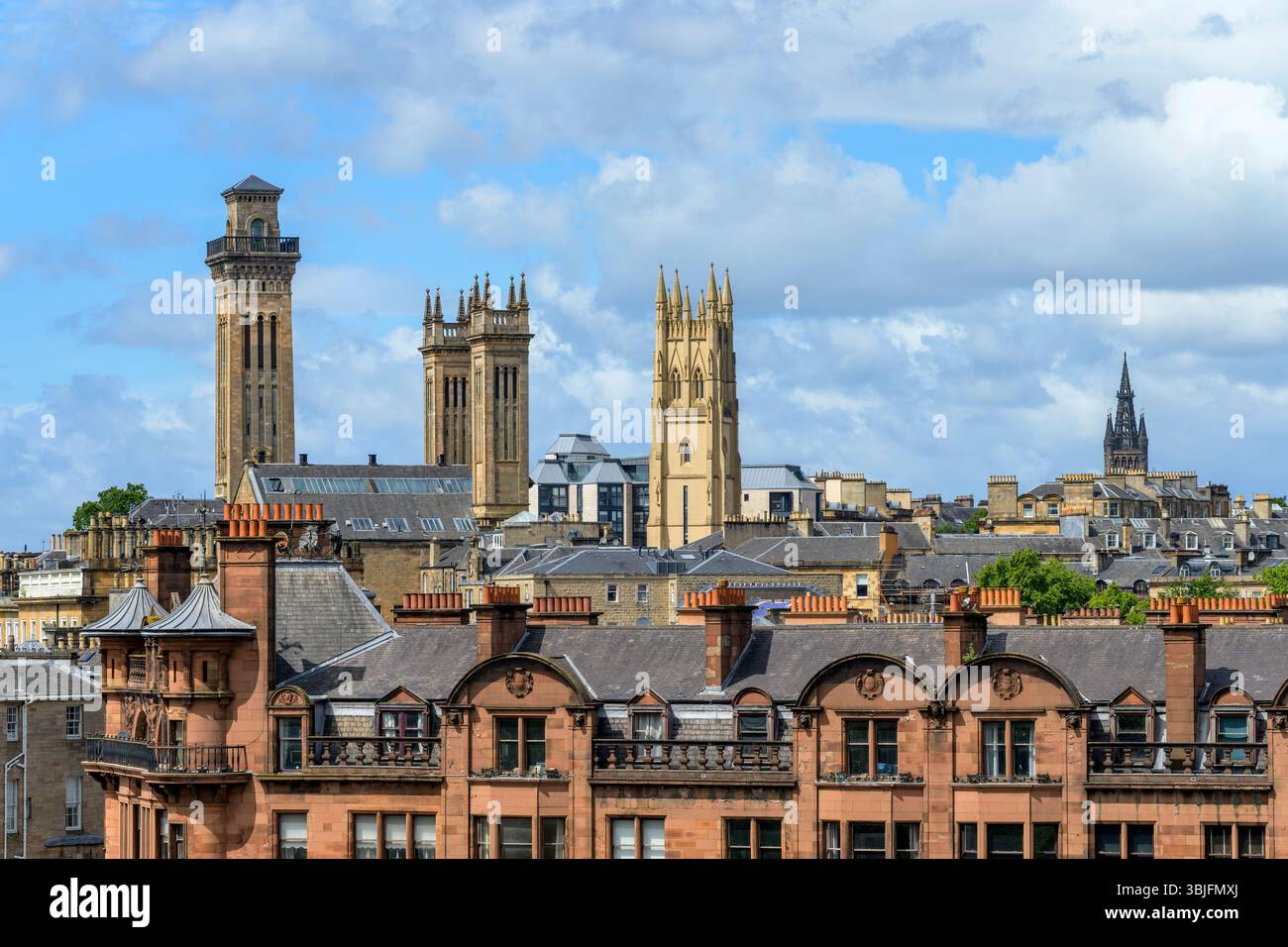 Trinity College, Park Church and University of Glasgow towers above St George's Mansions in the West End of Glasgow, Scotland, UK, Europe Stock Photo