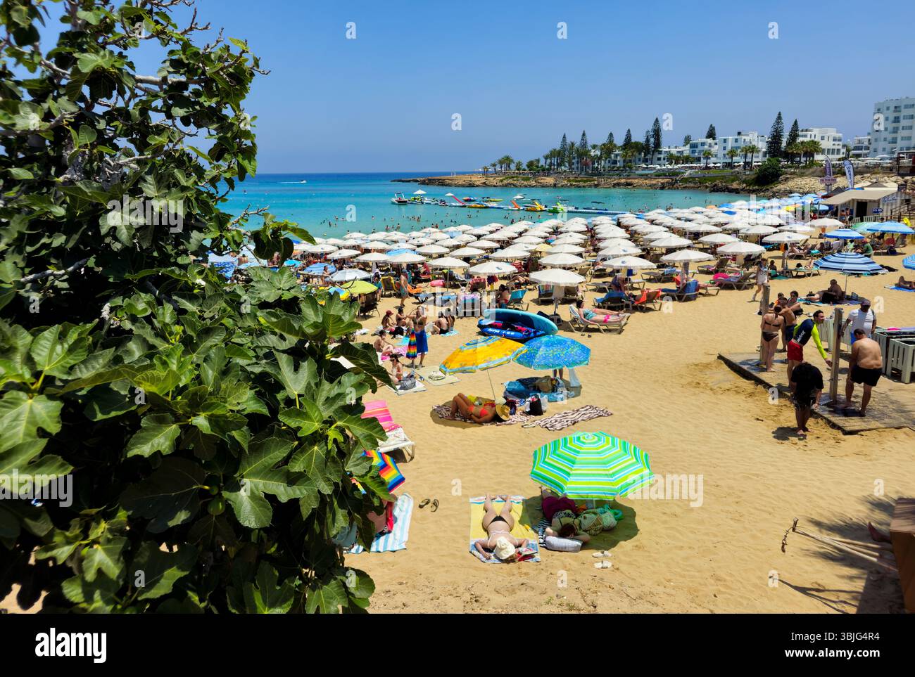 PROTARAS, CYPRUS , June 8 2025: Tourists at Fig Tree famous bay beach relaxing and enjoying their summer holidays at Protaras resort area in Cyprus. S Stock Photo