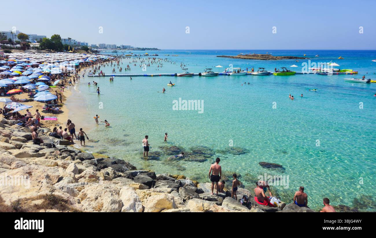 PROTARAS, CYPRUS , June 8 2025: Tourists at Fig Tree bay beach relaxing and enjoying their summer holidays at Protaras Cyprus. Stock Photo