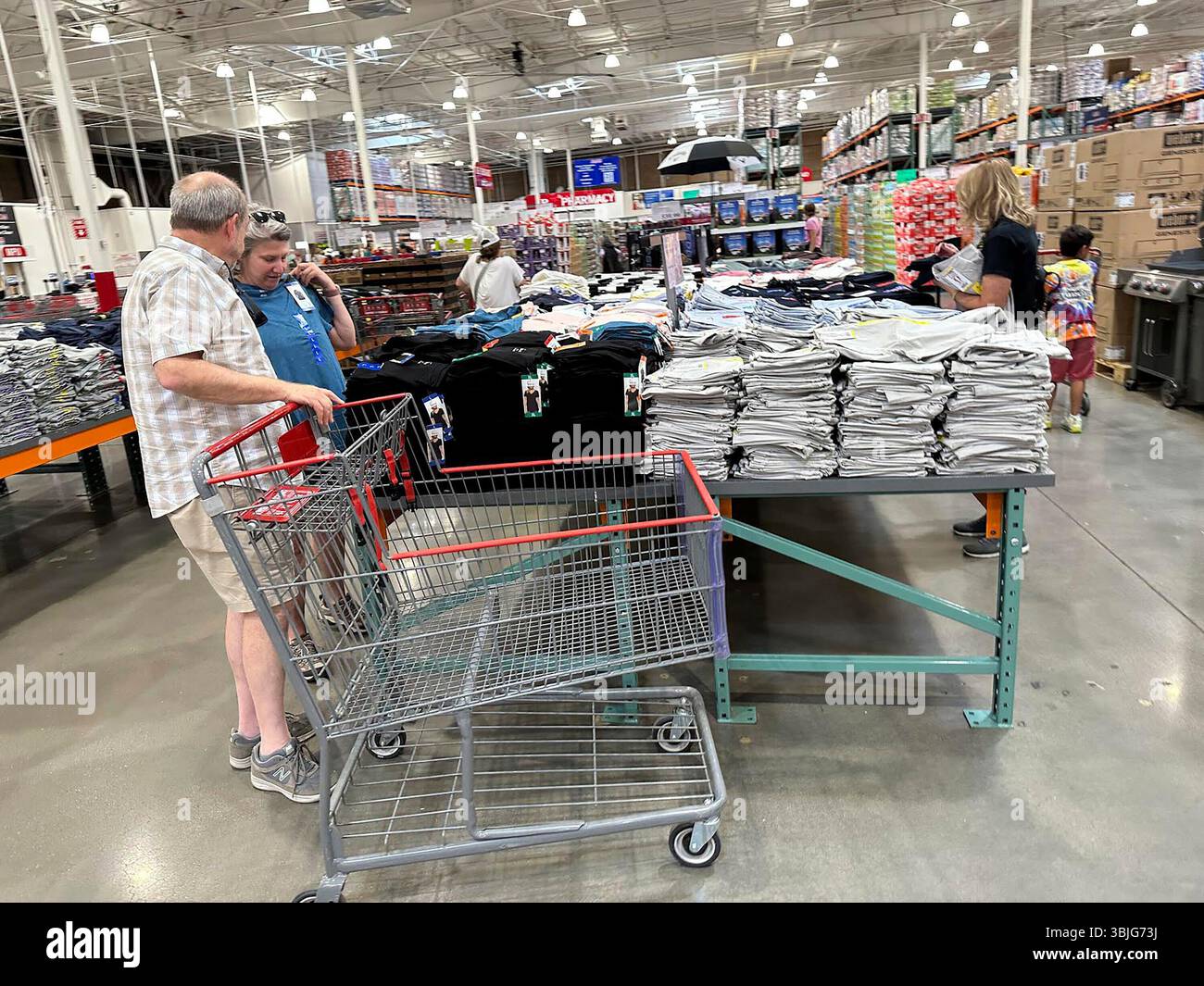 Shoppers consider a purchase in a Costco warehouse Wednesday, June 11 ...
