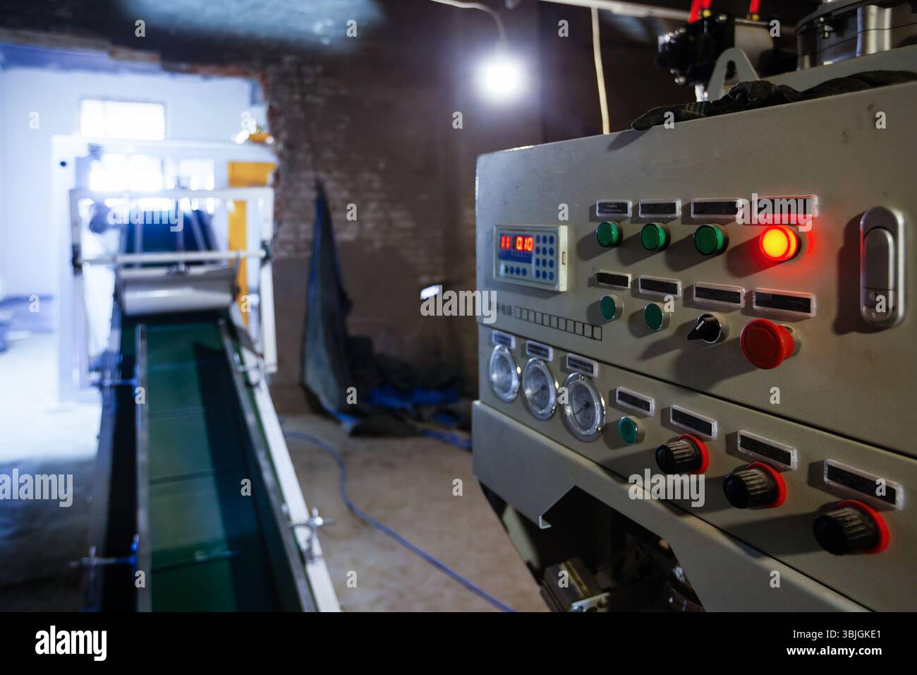 Control panel of CNC machine in industrial workshop. Stock Photo