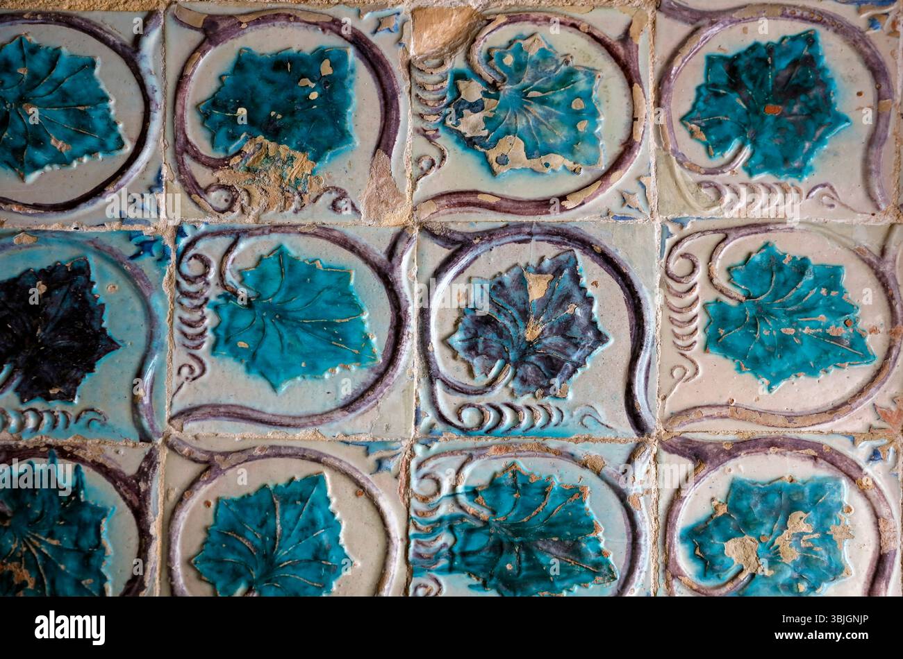 Worn tiles on wall in Partugal Stock Photo