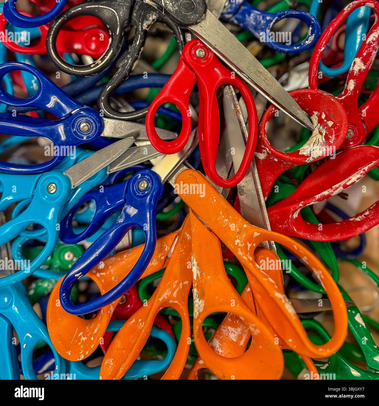 Color photo of a box of multiple plastic and stainless steel arts and ...