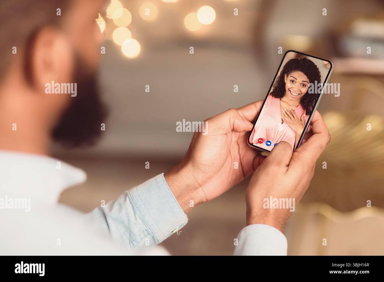 Black couple having online date using smart phones Stock Photo
