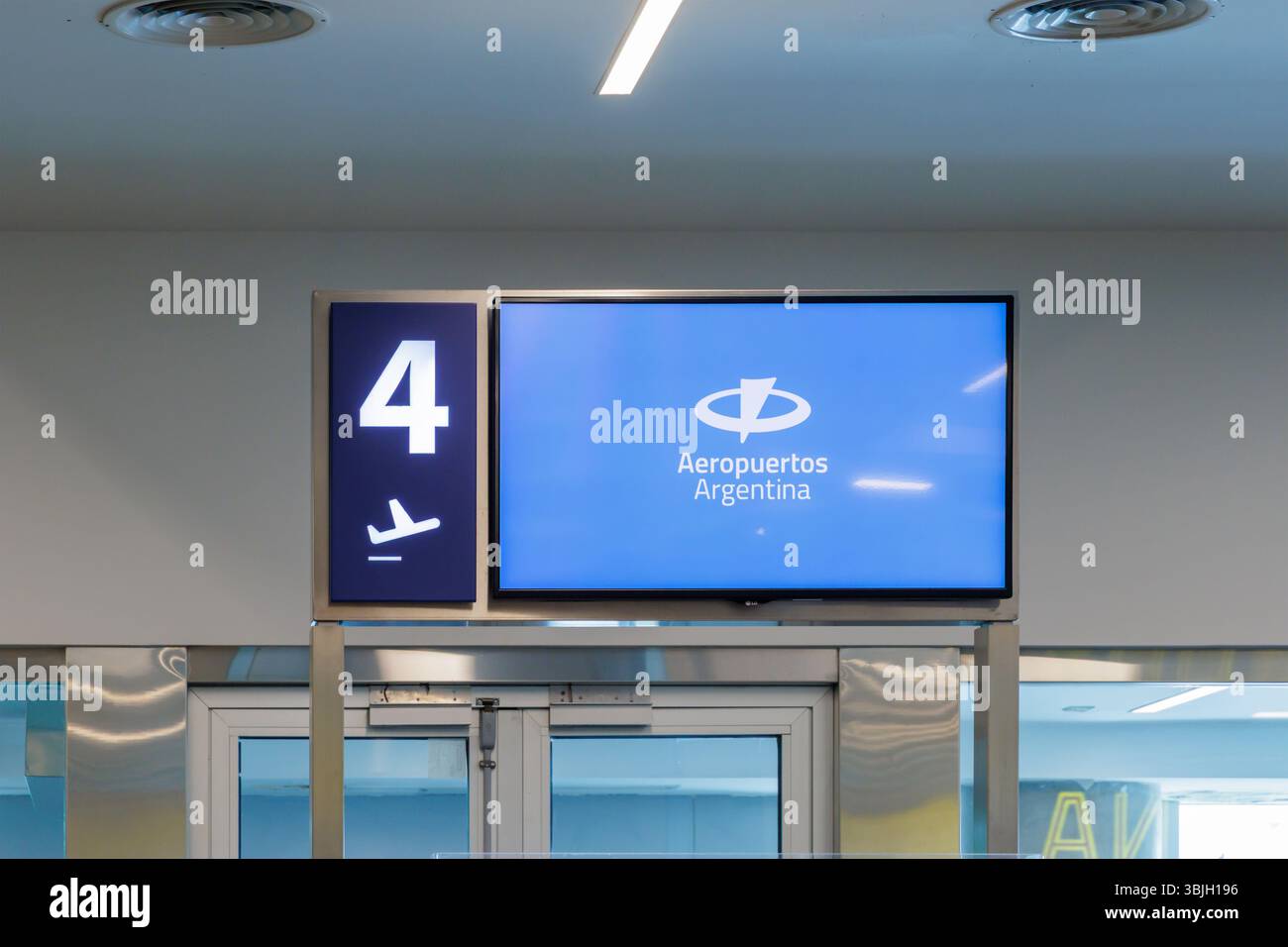 Puerto Iguazu, Misiones, Argentina - May 18th, 2025: Screen at a boarding gate with the Aeropuertos Argentina logo. Stock Photo