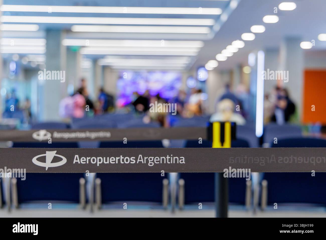 Puerto Iguazu, Misiones, Argentina - May 18th, 2025: Crowd control tape with the Aeropuertos Argentina logo. Stock Photo