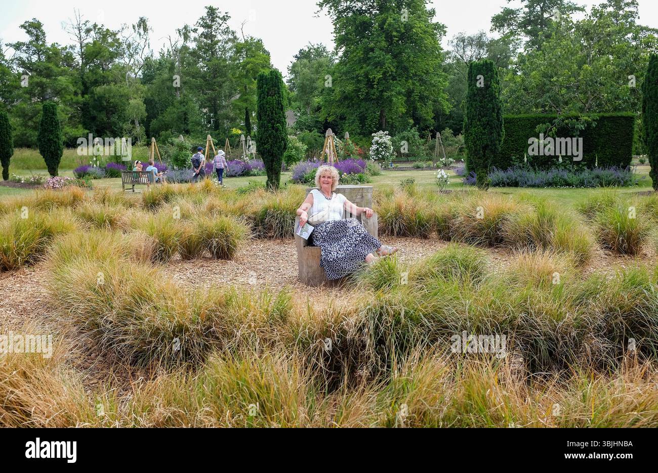 Cambridge UK June 2025 - Female visitor enjoying The Cambridge University Botanic Garden Stock Photo