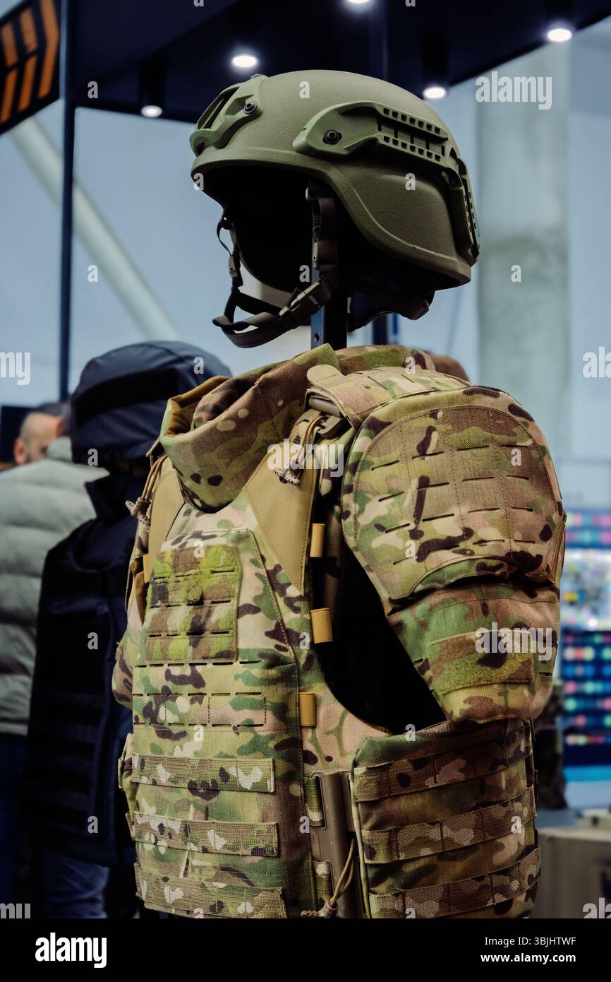A Close-Up Display of Military Equipment a Camouflage Helmet and Vest ...