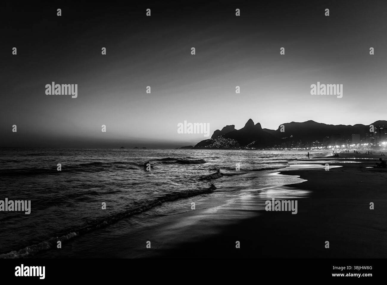 Black and White View of Ipanema Beach from Arpoador at Dusk - Rio de Janeiro, Brazil Stock Photo