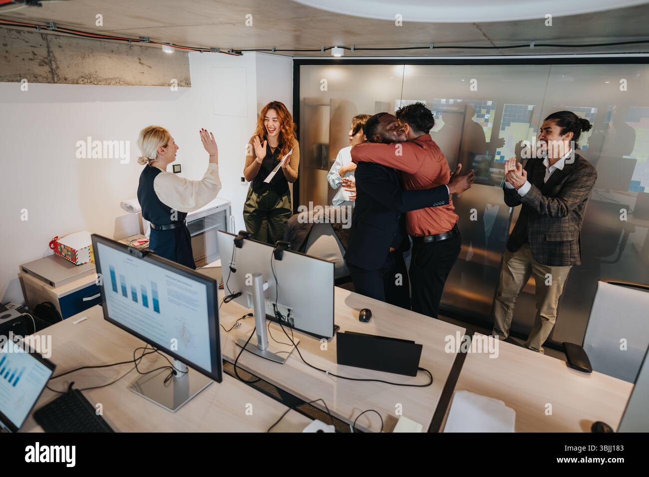 Business team celebrating success in a modern office environment Stock ...