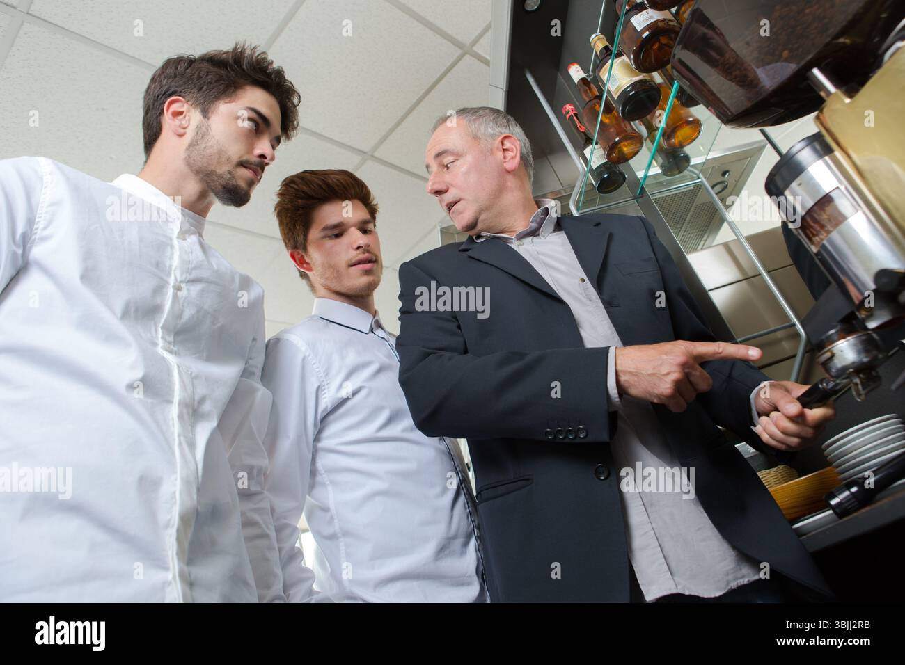 waiters learning from barista manager Stock Photo